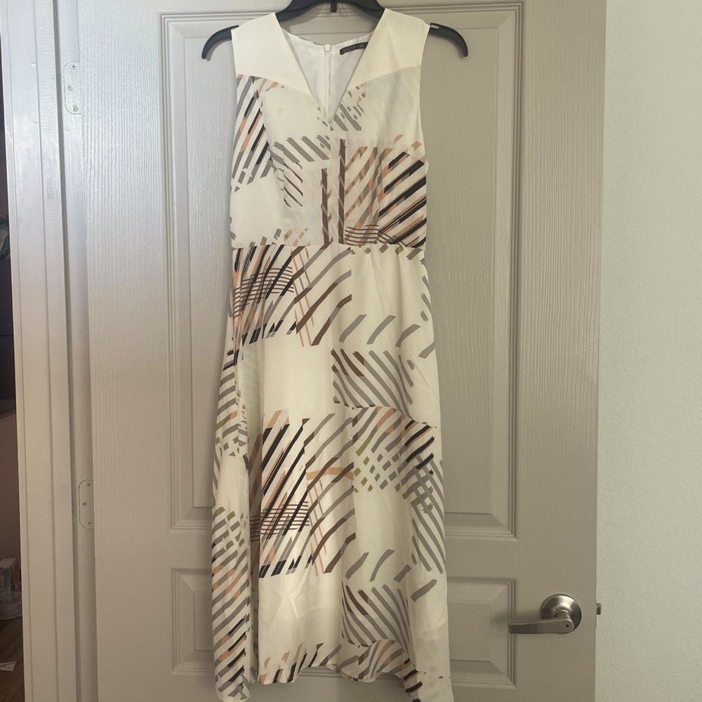 Moft classy dress. Falls just past the knees.